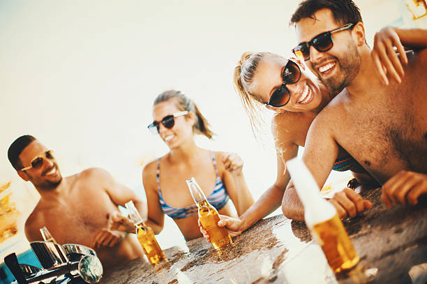 istock Friends having fun at beach bar. 522629938