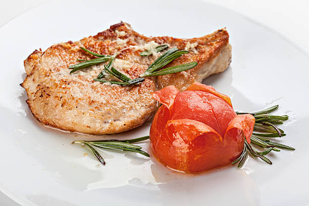 istock Pork chop on the plate. 522634968