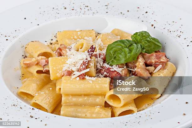 Italian Rigatoni Pasta With Prosciutto Parmesan Cheese And Leaf Stock Photo - Download Image Now