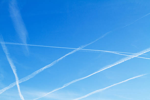 istock Vapor trails on winter sky 522637240