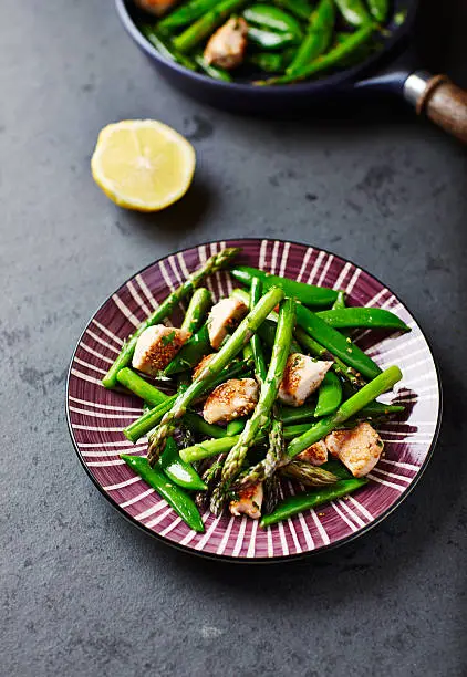 Stir-fired sesame chicken, green asparagus and sugar snap pea