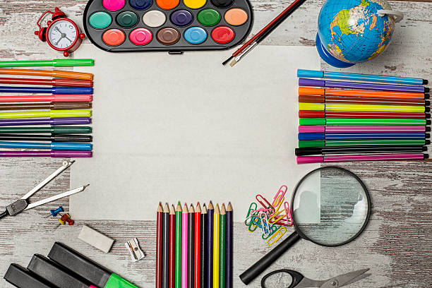 istock School and office supplies on wooden table 522640716
