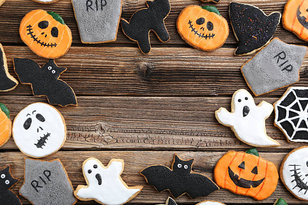 istock Fresh halloween gingerbread cookies on brown wooden table 522641524