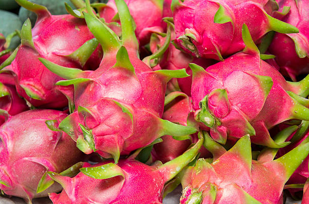 istock Dragon fruit on market stand, Thailand. 522641994