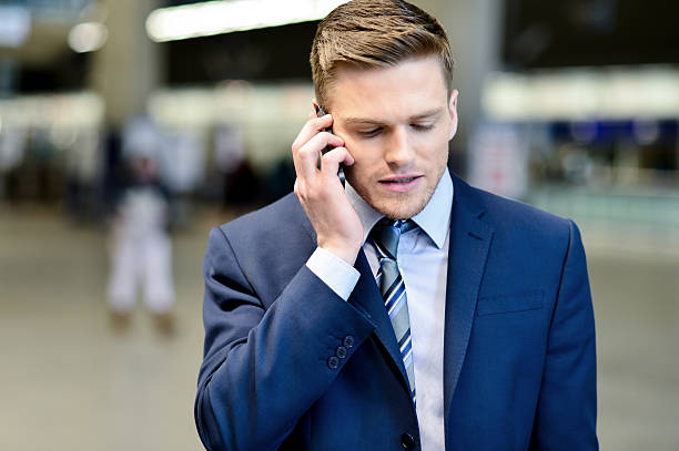 istock Businessman talking on phone outdoors 522648393