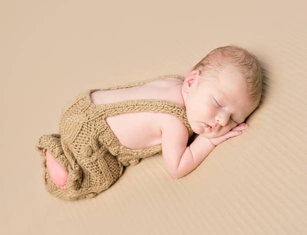 istock lovely baby sleeping on his stomach 522648556