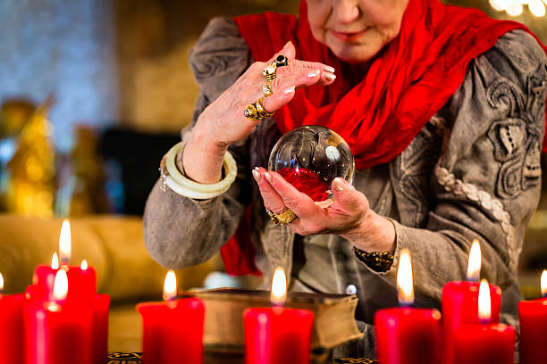 istock Soothsayer during session with crystal ball 522648861