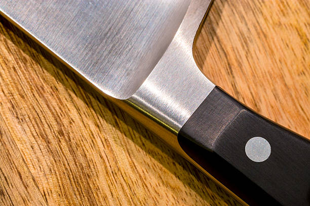 istock Kitchen knife on wooden board close-up 522649545