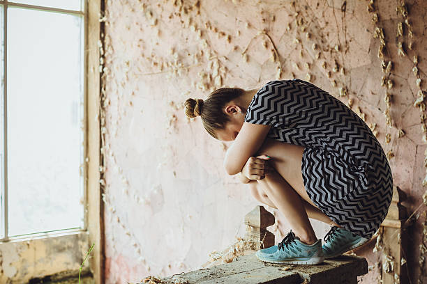 istock Lonely girl in an abandoned building 522649646