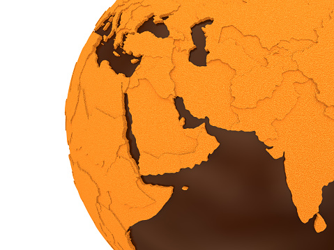 Middle East region on chocolate model of planet Earth. Sweet crusty continents with embossed countries and oceans made of dark chocolate. 3D rendering.