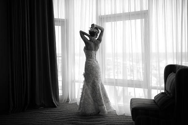 istock Silhouette of gorgeous bride in hotel room. 522649829