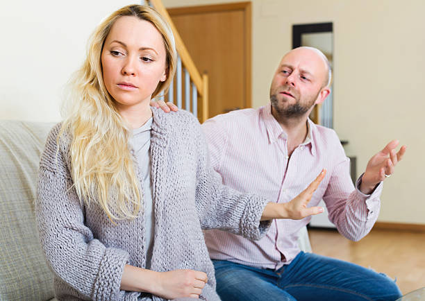 istock Man consoling the depressed woman 522650470