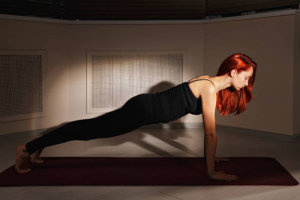 Redhead in yoga class stock photo