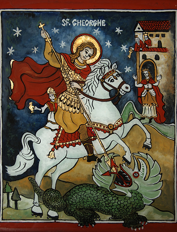 This is my artwork and I am the owner of the copyright. It represents a naive vertical icon of St.George killing the dragon and is painted right on the back of sheet of glass in traditional Romanian style. It needs a special technique and gold leaf. The dark blue sky is full of stars,the horse is white and the dragon is green. In the background there is the princess' castle . The icon is full of bright colors : red,blue,white, green and brown.