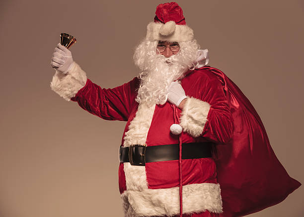 istock Santa Claus holding a his big bag on his shoulder 522651599