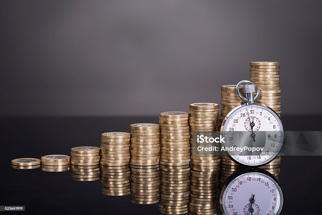 Time is money concept Time is money concept over black background Inflation - Economics Stock Photo