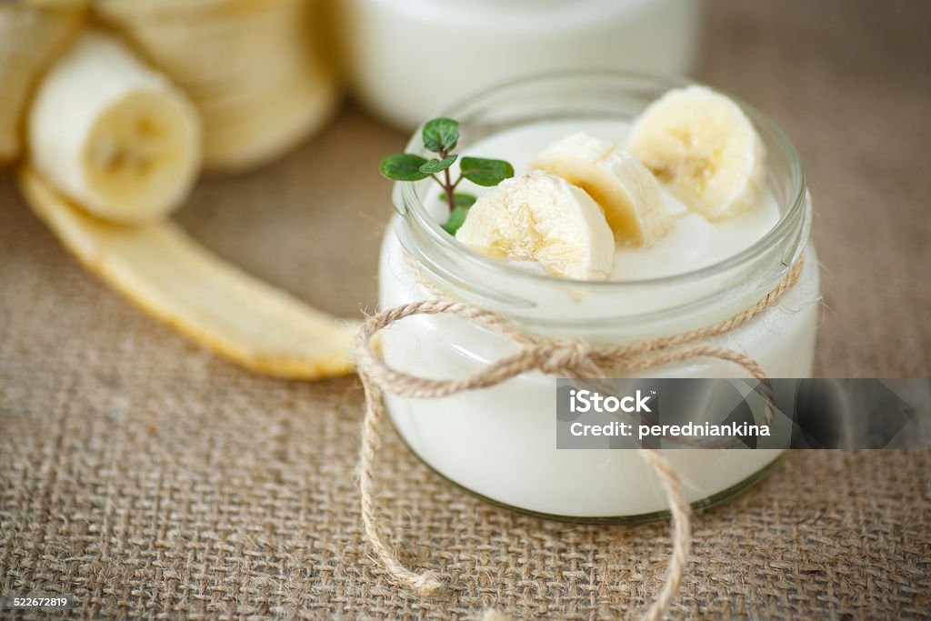 banana yogurt home sweet banana yogurt in a glass jar Banana Stock Photo
