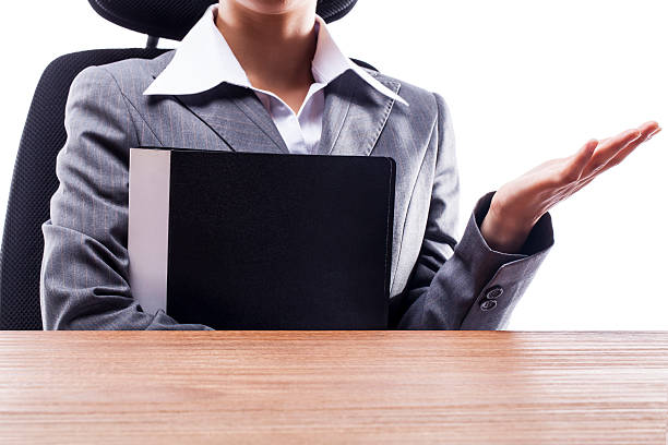 istock Businesswoman Holding Documents at Desk 522673319