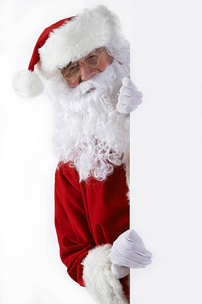 istock Santa Claus Looking Round Blank White Wall 522674049