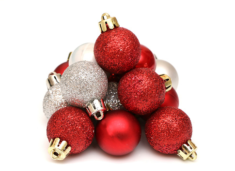 A pyramid of Christmas bobbles isolated on a white background