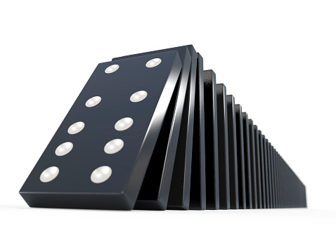 3d render of black dominoes falling