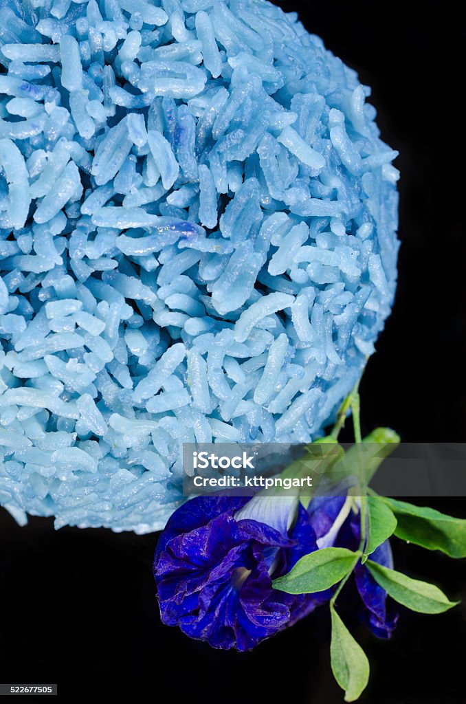Blue Butterfly pea cooked rice Rice cooked with blue butterfly pea isolated on black background Antioxidant Stock Photo