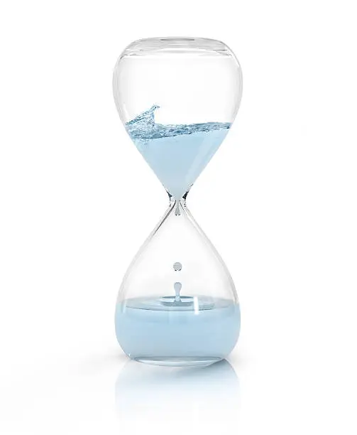 Photo of hourglass with dripping water close-up, time concept