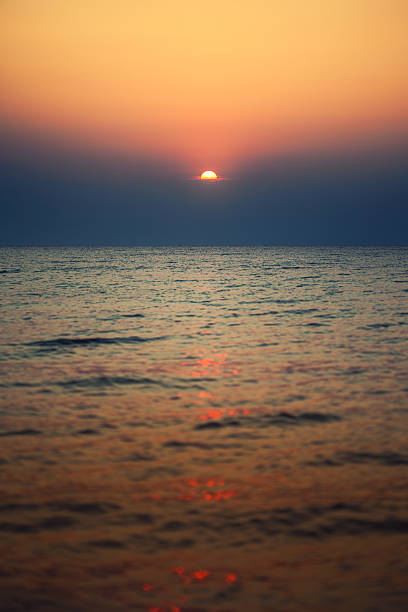 istock sunrise in the sea 522693491