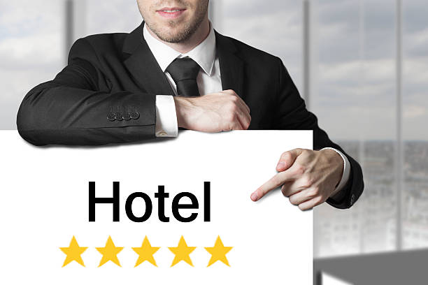 istock businessman pointing on sign hotel 522694047