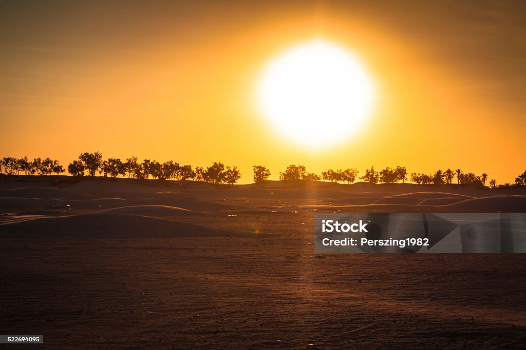 Sunset in the Sahara desert - Douz, Tunisia. Adventure Stock Photo