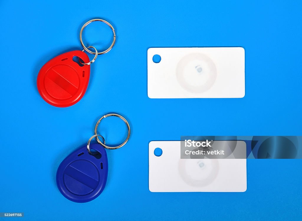 RFID cards and keychain two RFID cards and keychain on a blue background Computer Chip Stock Photo