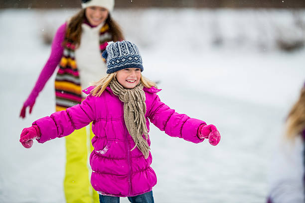 istock Family Ice-Skating on Pond 522697411