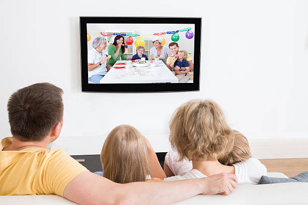 istock Young Family Watching TV Together 522712985