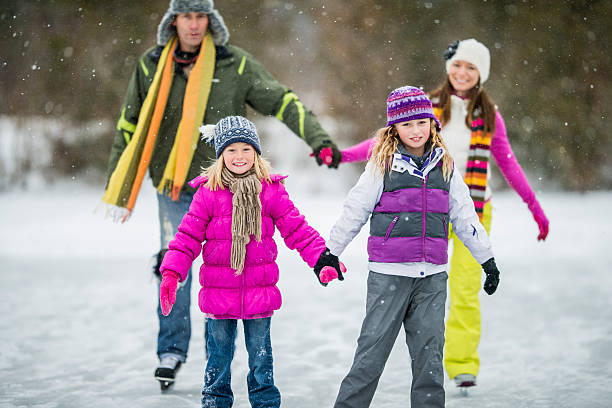istock Family Ice-Skating on Pond 522713737