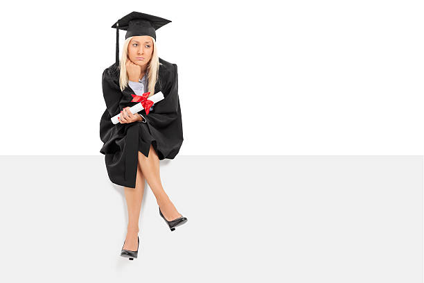 Sad female graduate holding a diploma