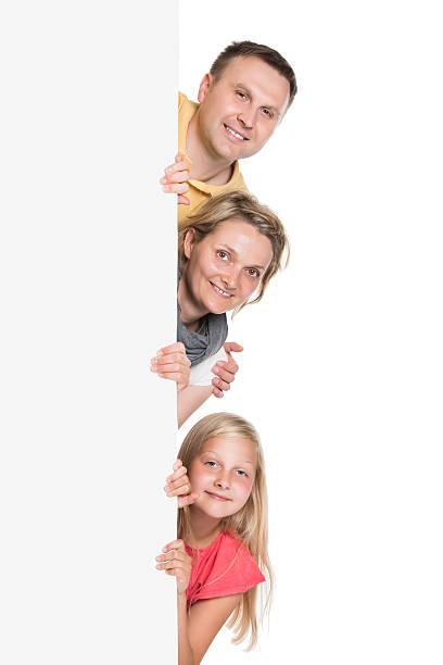 istock Happy Young Family Holding Banner 522716235