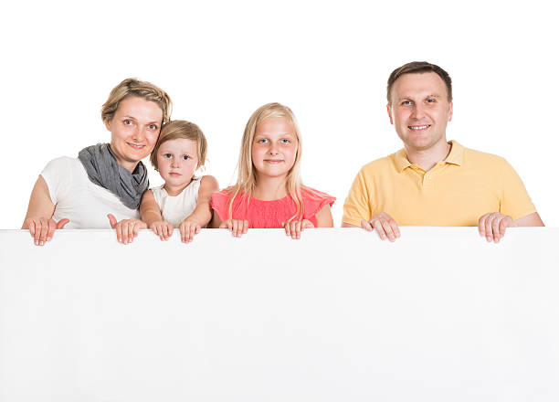 istock Happy Young Family Holding Banner 522717257