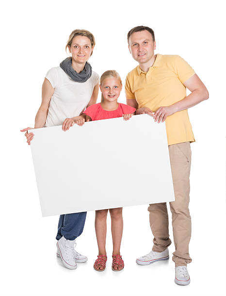 istock Happy Young Family Holding Banner 522717789