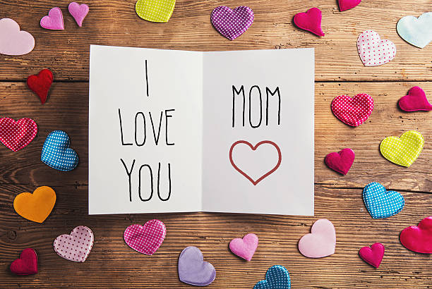 istock Mothers day composition, fabric hearts. Studio shot, wooden, bac 522723388