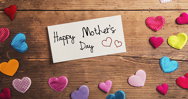 istock Mothers day composition, fabric hearts. Studio shot, wooden, bac 522723476