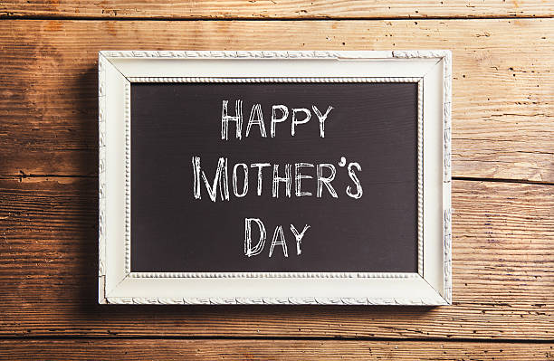 istock Mothers day composition. Picture frame. Wooden background. Studi 522723894