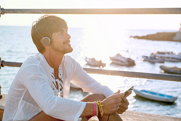 istock sitting by the sea in a sunny afternoon 522725026