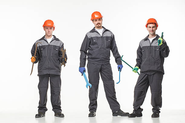 istock Group of industrial workers. Isolated over white background 522726454