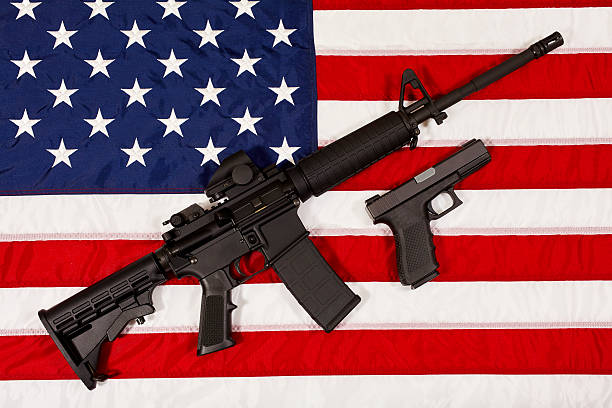 istock AR15 M4A1 Style Weapon Automatic Rifle and Pistol USA Flag 522726796