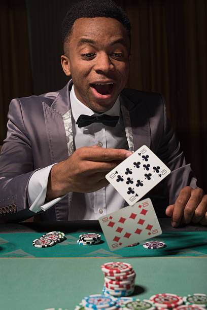 istock African-american man winning at the poker table 522728030
