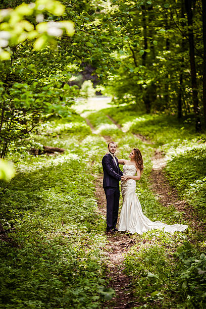 istock bridegroom and bride in the spring forest 522729762