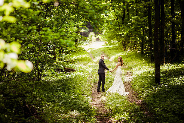 istock bridegroom and bride in the spring forest 522729808