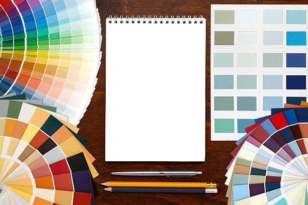 istock Color palette guide on the wooden background and notepad. 522732750
