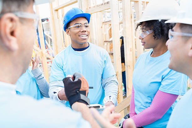 istock Young male construction foreman briefs volunteer crew 522734468