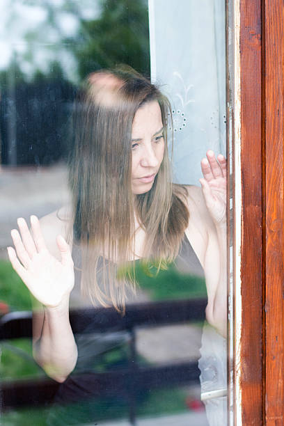 istock Depressed woman standing 522734786